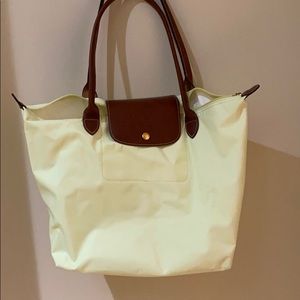 Yellow Longchamp bag.